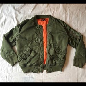 Gilbert Green bomber jacket with orange interior